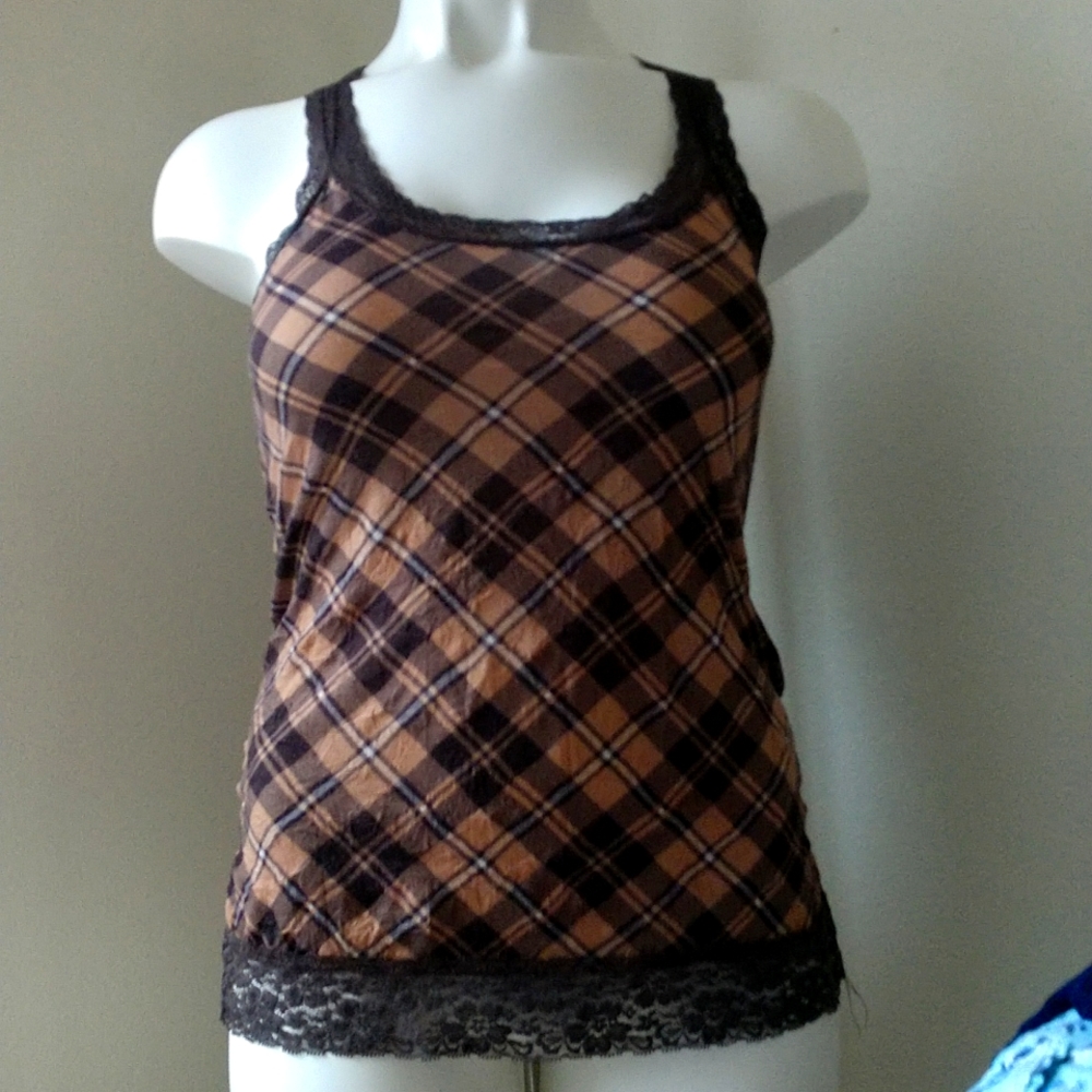 Misses racer back plaid tank with lace neckline and bottom.Figure flattering cut